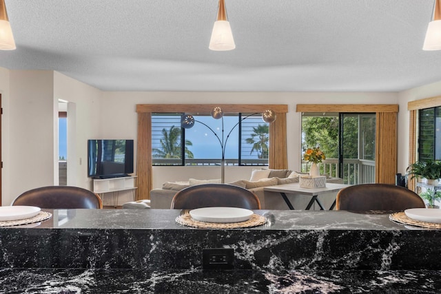 73-4332 Imo Pl, Kailua-Kona, HI 96740 - dining area with healthy amount of natural light and a textured ceiling