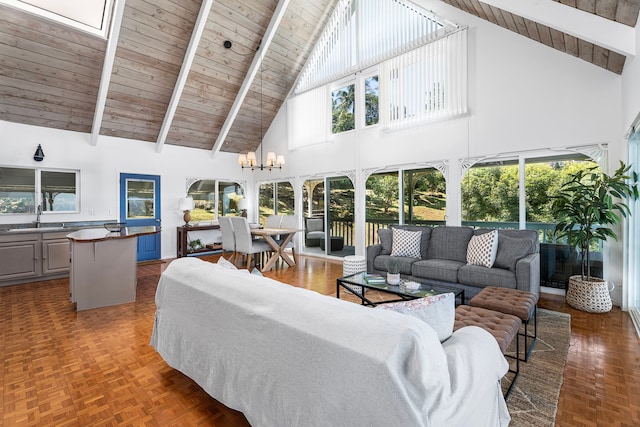 36-2333 Old Mamalahoa Hwy, Laupahoehoe, HI 96764 - living room with high vaulted ceiling, wood ceiling with exposed beams, a skylight, and a chandelier