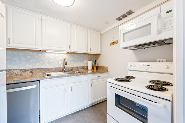 75-5719 Alii Dr Unit 321, Kailua-Kona, HI 96740 - kitchen with white appliances, white cabinetry, light tile patterned floors, backsplash, and light stone countertops