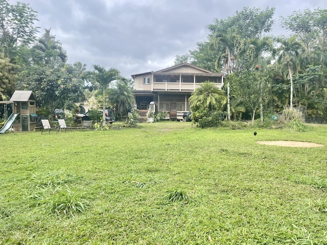 1370 Honoohala Pl, Kapaa, HI 96746 - view of green lawn featuring a playground and a balcony