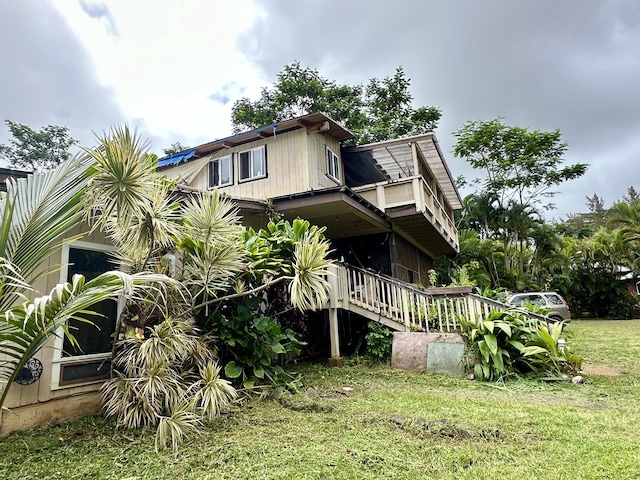 1370 Honoohala Pl, Kapaa, HI 96746 - view of side of home featuring a yard and a balcony