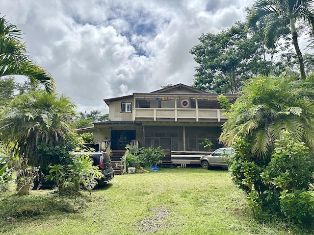 1370 Honoohala Pl, Kapaa, HI 96746 - rear view of property featuring a balcony and a lawn