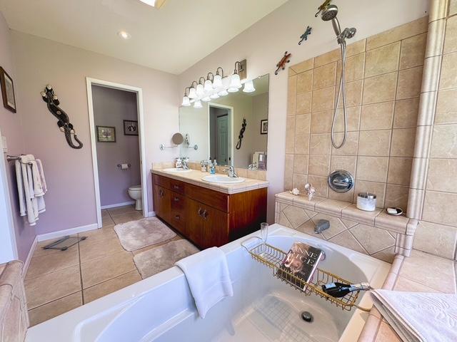 15-1500 10th Ave, Keaau, HI 96749 - full bathroom with a bath, double vanity, toilet, and tiled shower
