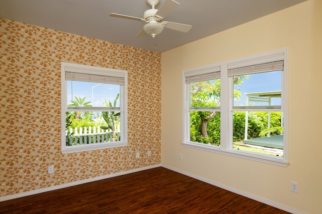 75-679 Kuahiwi Pl, Kailua-Kona, HI 96740 - empty room with dark wood-type flooring, wallpapered walls, and a ceiling fan