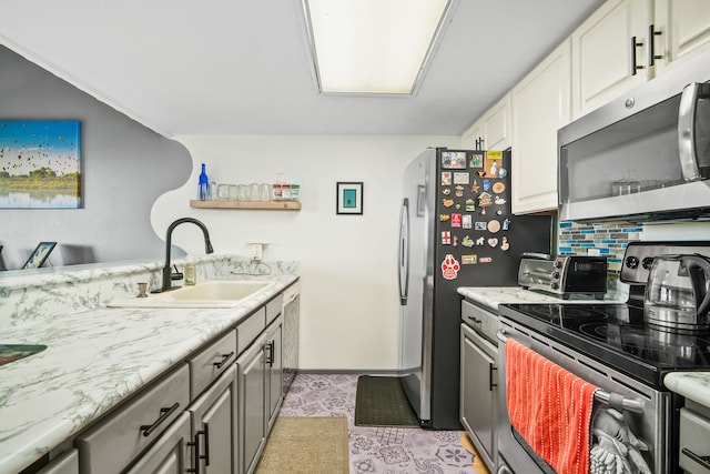 4460 Ikena Pl Unit 54, Kalaheo, HI 96741 - kitchen featuring stainless steel appliances, tasteful backsplash, gray cabinets, white cabinets, and open shelves