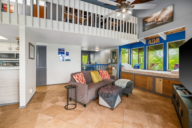 4460 Ikena Pl Unit 54, Kalaheo, HI 96741 - living room with a high ceiling, a ceiling fan, and light tile patterned flooring