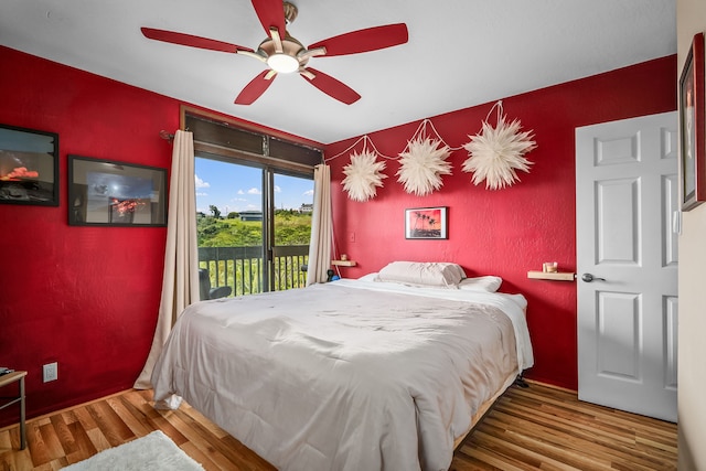 4460 Ikena Pl Unit 54, Kalaheo, HI 96741 - bedroom with access to exterior, wood finished floors, and ceiling fan