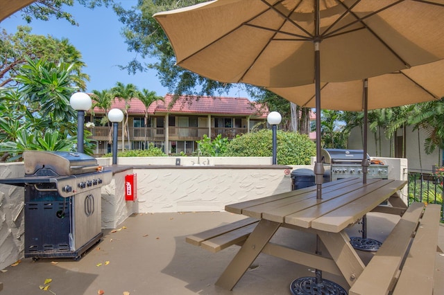 75-5873 Walua Rd Unit 312, Kailua-Kona, HI 96740 - view of patio / terrace featuring a grill and outdoor dining area