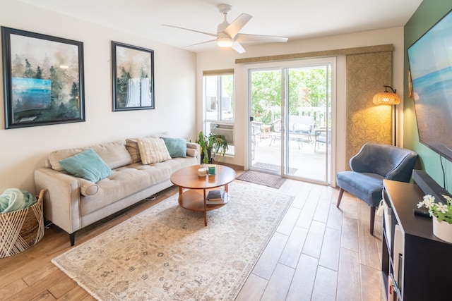 75-6081 Alii Dr Unit Kk102, Kailua-Kona, HI 96740 - living room featuring a ceiling fan and light wood-style floors
