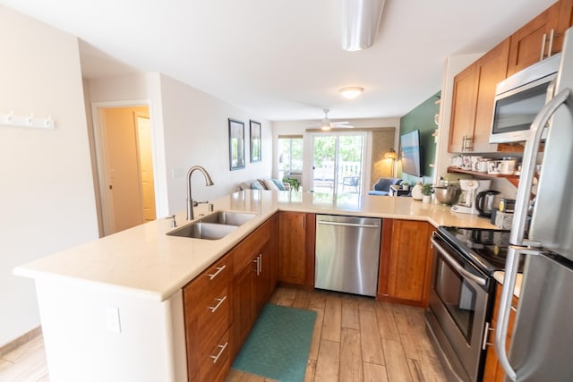 75-6081 Alii Dr Unit Kk102, Kailua-Kona, HI 96740 - kitchen with stainless steel appliances, a sink, open floor plan, and light countertops