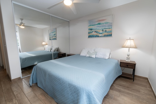 75-6081 Alii Dr Unit Kk102, Kailua-Kona, HI 96740 - bedroom featuring a closet, wood finished floors, and ceiling fan