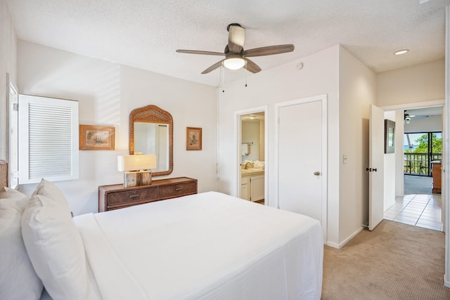 410 Papaloa Rd Unit 225, Kapaa, HI 96746 - bedroom featuring light colored carpet, a ceiling fan, and ensuite bathroom