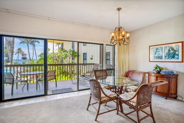 410 Papaloa Rd Unit 225, Kapaa, HI 96746 - dining space featuring a chandelier, light colored carpet, and light tile patterned flooring