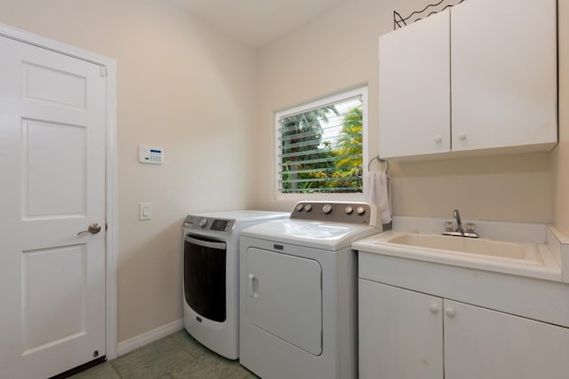 76-987 Aeo St, Kailua-Kona, HI 96740 - laundry room with washing machine and dryer, cabinet space, baseboards, and light tile patterned flooring