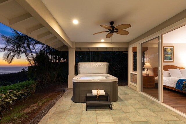 76-987 Aeo St, Kailua-Kona, HI 96740 - patio terrace at dusk with a ceiling fan, a patio, and a hot tub