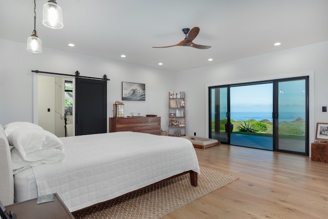 75-650 Halewili Pl, Kailua-Kona, HI 96725 - bedroom with access to outside, light wood-style floors, recessed lighting, a barn door, and a ceiling fan