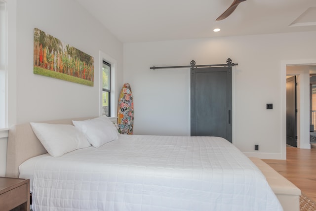 75-650 Halewili Pl, Kailua-Kona, HI 96725 - bedroom featuring wood finished floors, recessed lighting, a barn door, and ceiling fan
