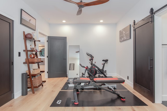 75-650 Halewili Pl, Kailua-Kona, HI 96725 - workout room with a barn door, light wood finished floors, ceiling fan, and recessed lighting