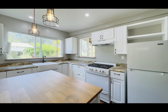 11-3250 Lehua St, Mountain View, HI 96771 - kitchen featuring white appliances, under cabinet range hood, a sink, open shelves, and white cabinets