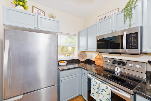 73-1102 Nuuanu Pl Unit F203, Kailua-Kona, HI 96740 - kitchen featuring stainless steel appliances and dark stone counters