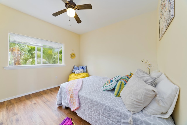 73-1102 Nuuanu Pl Unit F203, Kailua-Kona, HI 96740 - bedroom with wood finished floors and ceiling fan