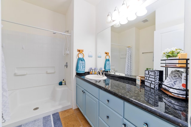 73-1102 Nuuanu Pl Unit F203, Kailua-Kona, HI 96740 - full bathroom featuring vanity, curtained shower, and tile patterned floors