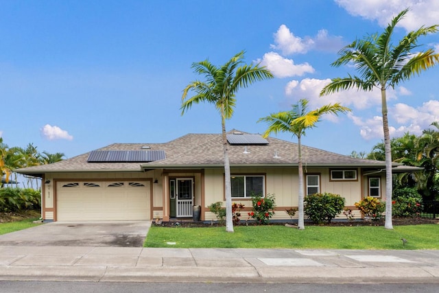 75-650 Mea Lanakila St, Kailua-Kona, HI 96740 - ranch-style house with a garage, driveway, a front yard, roof mounted solar panels, and roof with shingles