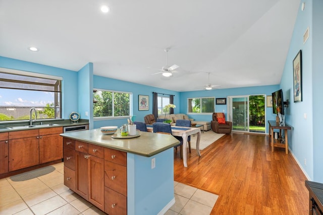 75-650 Mea Lanakila St, Kailua-Kona, HI 96740 - kitchen with a center island, ceiling fan, open floor plan, brown cabinetry, and recessed lighting