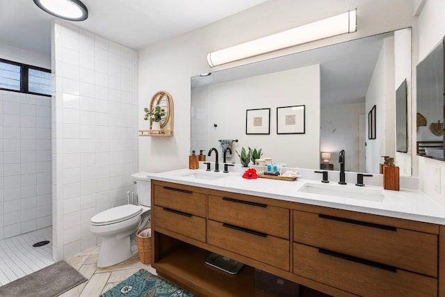 78-7070 Alii Dr Unit E103, Kailua-Kona, HI 96740 - bathroom with double vanity, toilet, tiled shower, and tile patterned floors