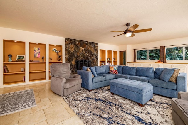 78-7259 Puuloa Rd, Kailua-Kona, HI 96740 - living area featuring ceiling fan, built in features, a textured ceiling, and a stone fireplace