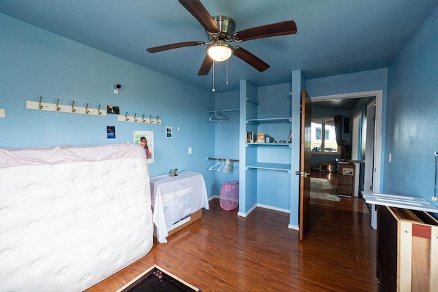 16-2041 Emerald Dr, Pahoa, HI 96778 - bedroom with wood finished floors, baseboards, and ceiling fan