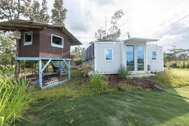16-2041 Emerald Dr, Pahoa, HI 96778 - view of property exterior with a yard and an outbuilding