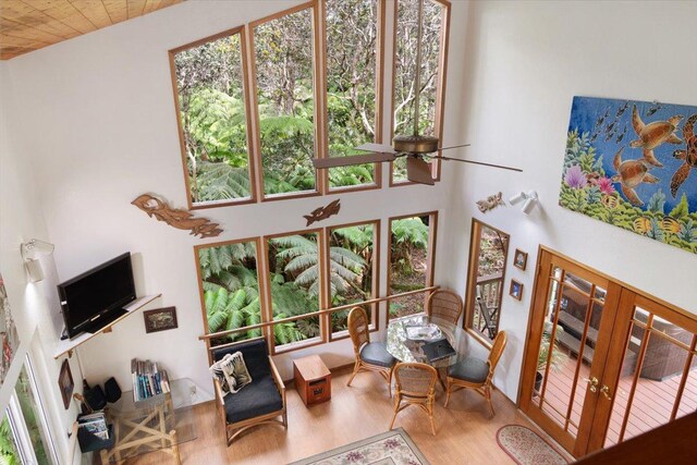 11-3868 Liona St, Volcano, HI 96785 - living room featuring wood finished floors, french doors, a towering ceiling, and wood ceiling