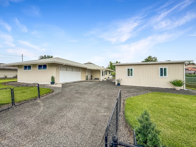 410 Olu St, Hilo, HI 96720 - view of front of property with an attached garage and asphalt driveway