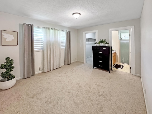 410 Olu St, Hilo, HI 96720 - bedroom featuring a textured ceiling, carpet, a spacious closet, and ensuite bathroom