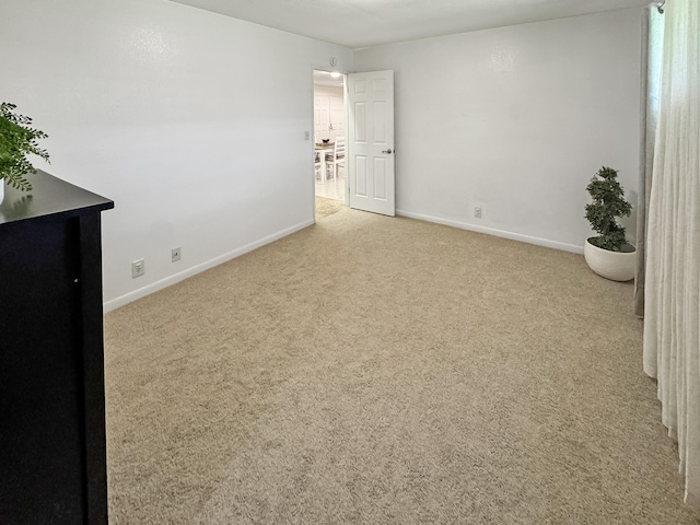 410 Olu St, Hilo, HI 96720 - unfurnished room featuring baseboards and carpet