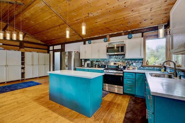 13-1312 Malama St, Pahoa, HI 96778 - kitchen with appliances with stainless steel finishes, blue cabinets, a center island, wood ceiling, and decorative light fixtures