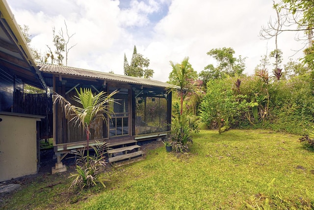 13-1312 Malama St, Pahoa, HI 96778 - view of grassy yard featuring a sunroom
