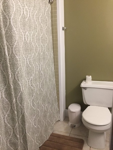 400 Hualani St Unit 1301, Hilo, HI 96720 - full bath with curtained shower and tile patterned floors