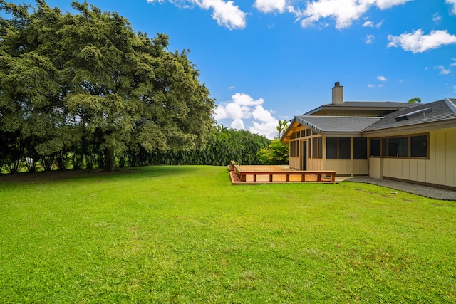4675 Wailapa Rd, Kilauea, HI 96754 - view of grassy yard featuring a sunroom and a deck
