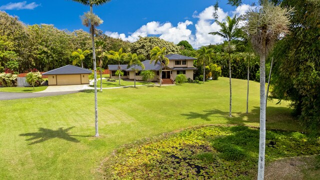 4675 Wailapa Rd, Kilauea, HI 96754 - view of green lawn featuring a garage
