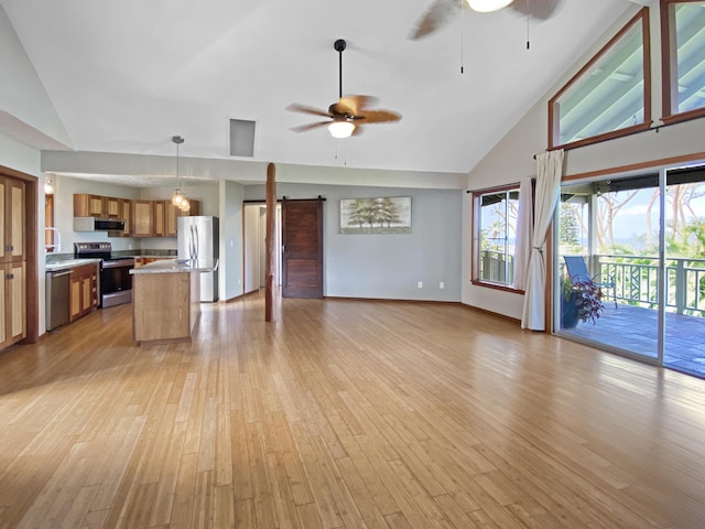 76-6323 Mahuahua Pl, Kailua-Kona, HI 96740 - unfurnished living room featuring a ceiling fan, high vaulted ceiling, a barn door, and light wood finished floors