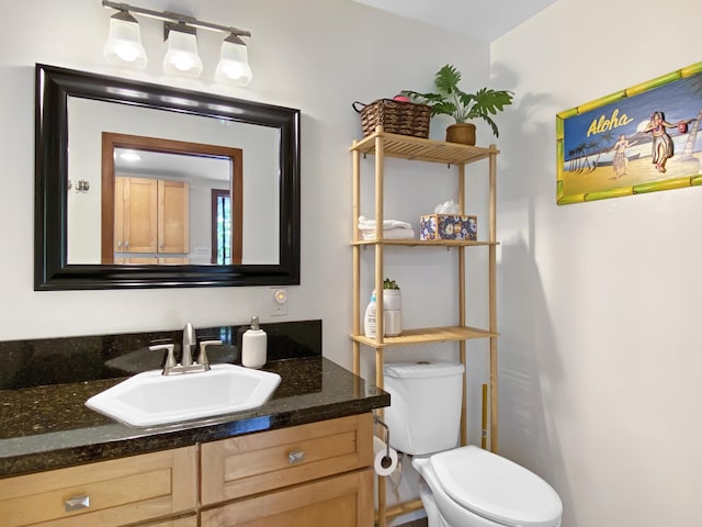 76-6323 Mahuahua Pl, Kailua-Kona, HI 96740 - half bathroom featuring vanity and toilet
