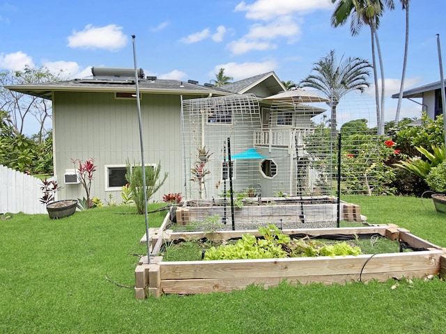 76-6323 Mahuahua Pl, Kailua-Kona, HI 96740 - back of house with a garden and a shingled roof