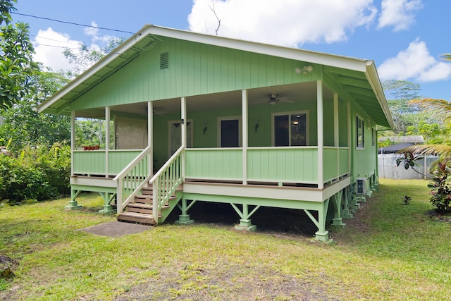 14-3385 Paradise Rd, Pahoa, HI 96778 - view of front of house featuring a ceiling fan and a front lawn