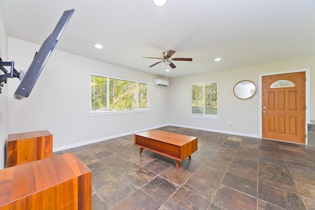 14-3385 Paradise Rd, Pahoa, HI 96778 - living room with a ceiling fan, plenty of natural light, a wall mounted AC, stone finish floors, and recessed lighting