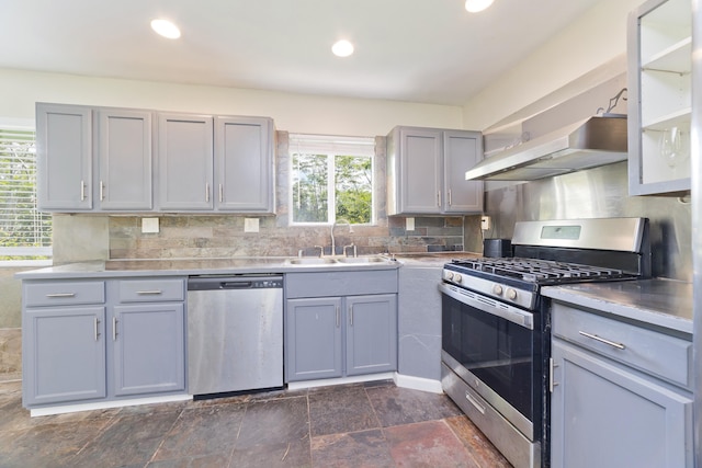 14-3385 Paradise Rd, Pahoa, HI 96778 - kitchen featuring stainless steel appliances, range hood, gray cabinetry, tasteful backsplash, and recessed lighting
