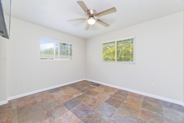 14-3385 Paradise Rd, Pahoa, HI 96778 - empty room featuring stone finish flooring and ceiling fan