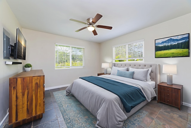 14-3385 Paradise Rd, Pahoa, HI 96778 - bedroom with multiple windows, stone tile flooring, and a ceiling fan