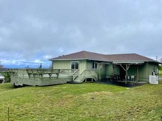 94-1654 Lewa Nuu St, Naalehu, HI 96772 - back of property featuring a lawn and a deck